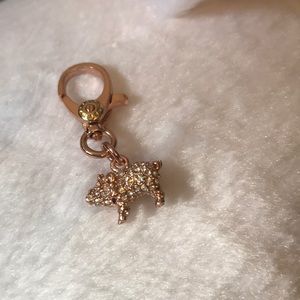 Henri Bendel Henrietta pig charm.